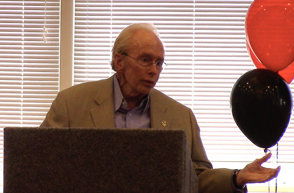 photo of man in front of podium