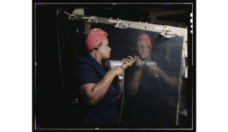 LOC: Operating a hand drill at Vultee-Nashville, woman is working on a "Vengeance" dive bomber, Tennessee