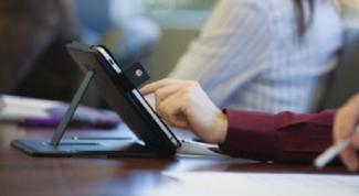 remote communication image of a hand and ipad