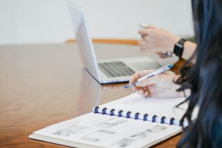 photo of student taking notes