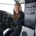 photo of Dr. Holly Miowak Guise, in a small airplane, Alaska