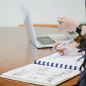 image of student with agenda and laptop