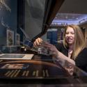 Photo of Sarah Anderson working on The Moon Rocks! exhibit at Russell Library